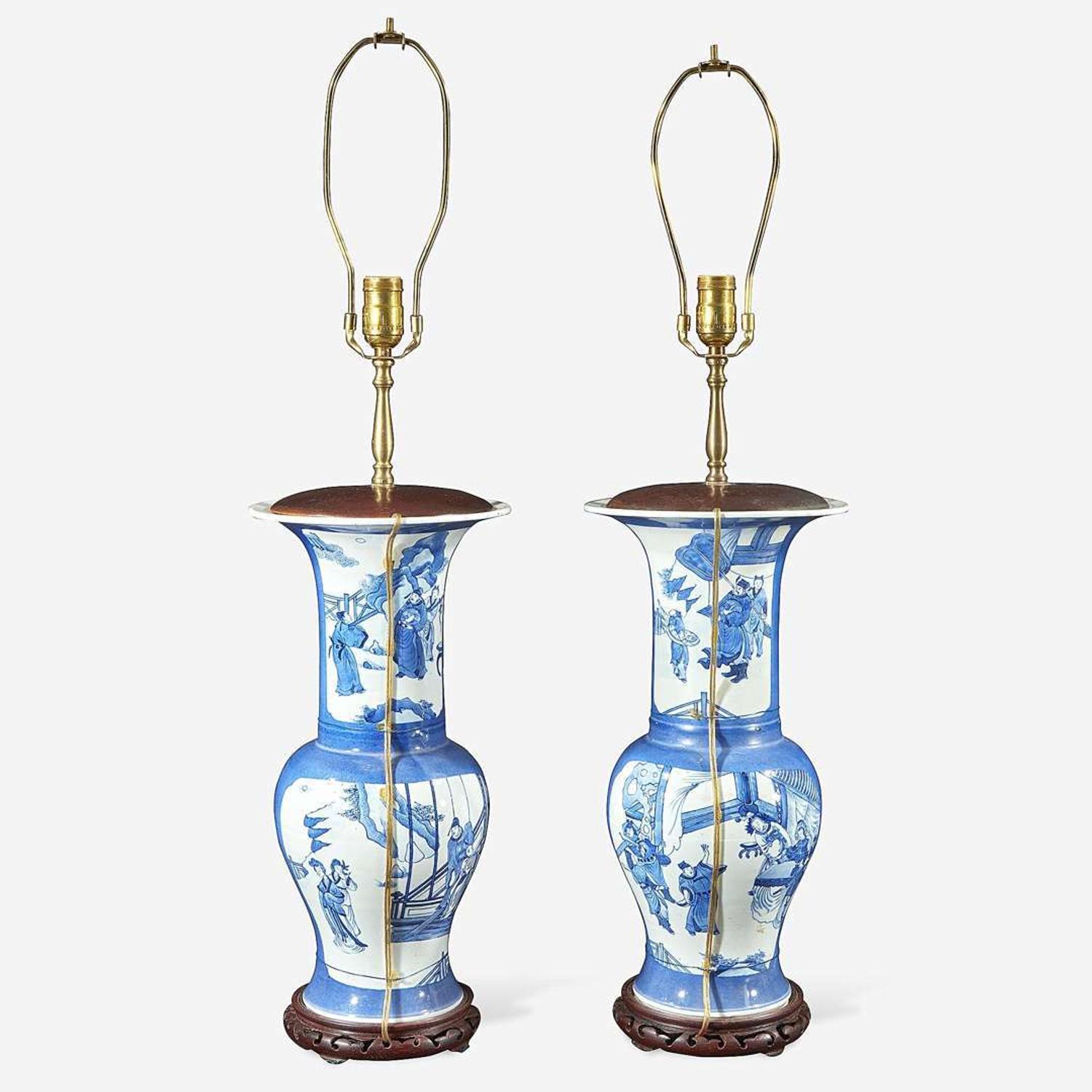 A pair of Chinese blue and white powder-blue ground “Phoenix-tail” vases mounted as lamps Kangxi style