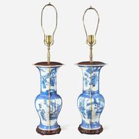A pair of Chinese blue and white powder-blue ground “Phoenix-tail” vases mounted as lamps Kangxi style