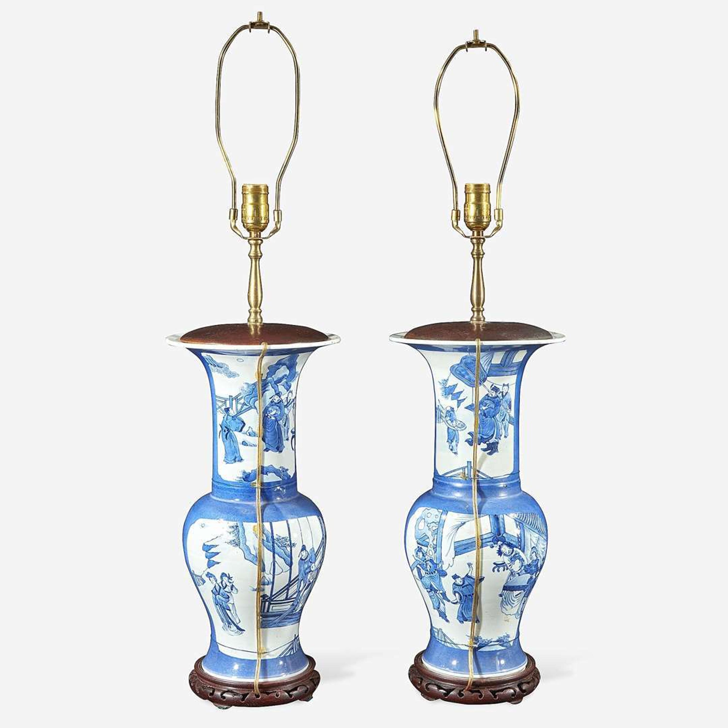 A pair of Chinese blue and white powder-blue ground “Phoenix-tail” vases mounted as lamps Kangxi style