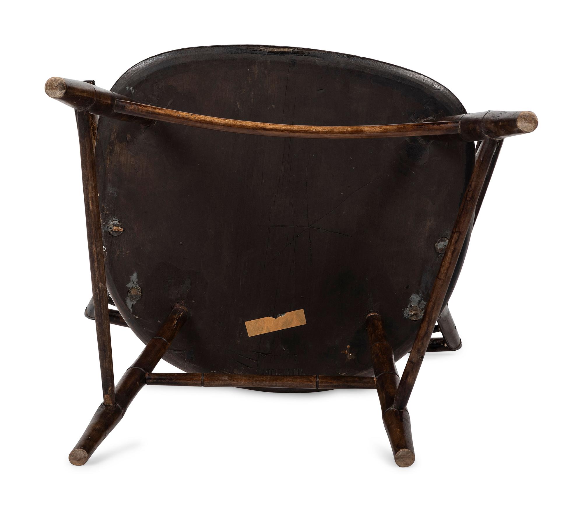 A Birdcage Windsor Scroll-Carved Armchair