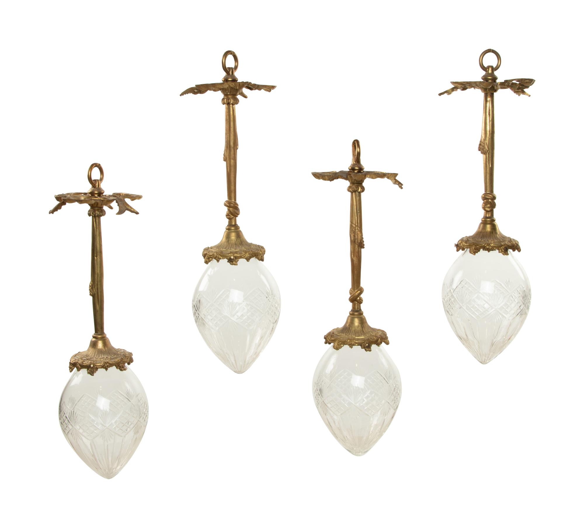A Set of Four Gilt Bronze and Cut Glass Pendant Lights