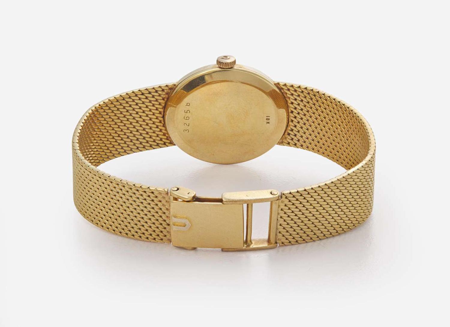 An 18K Yellow Gold Ladies Universal Geneve Watch