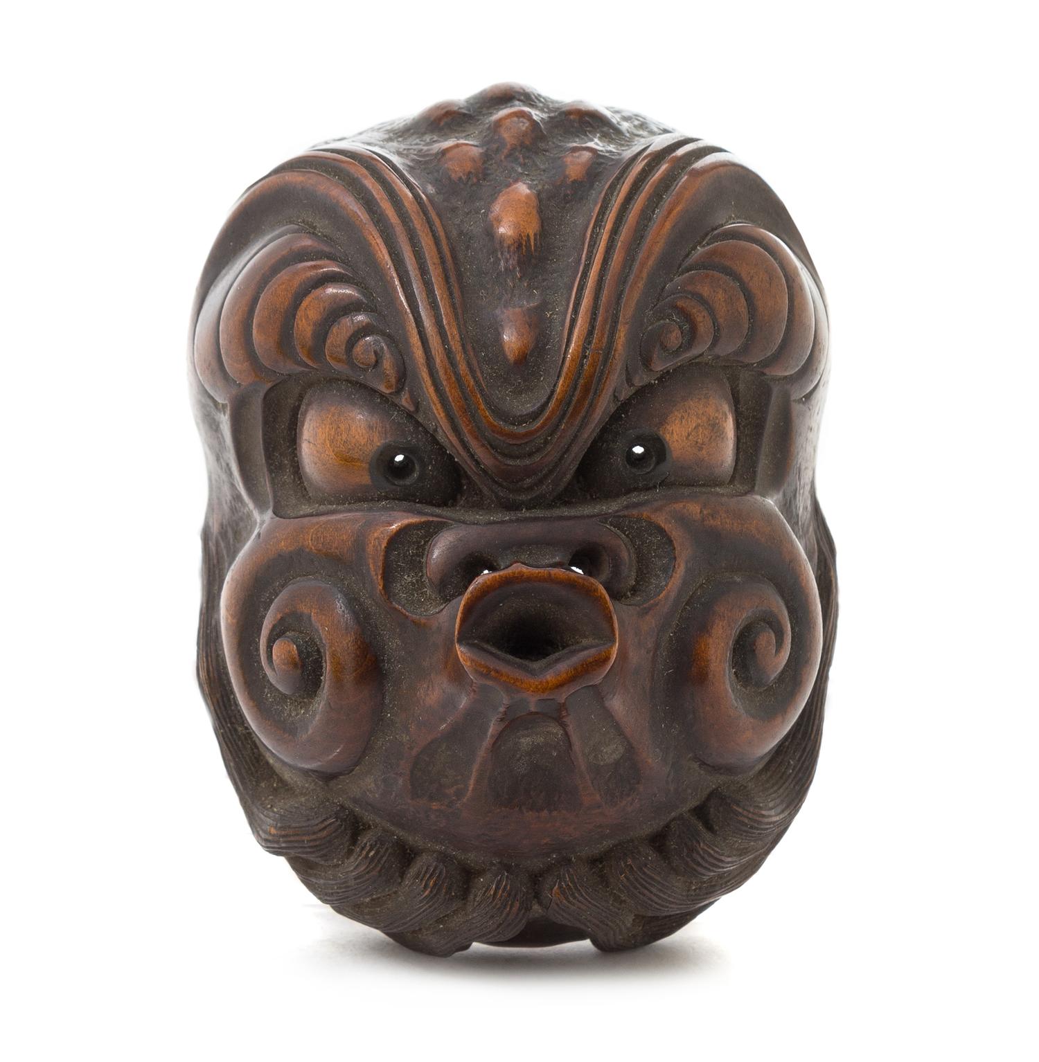 A Japanese Boxwood Netsuke Length 3 1/4 inches.