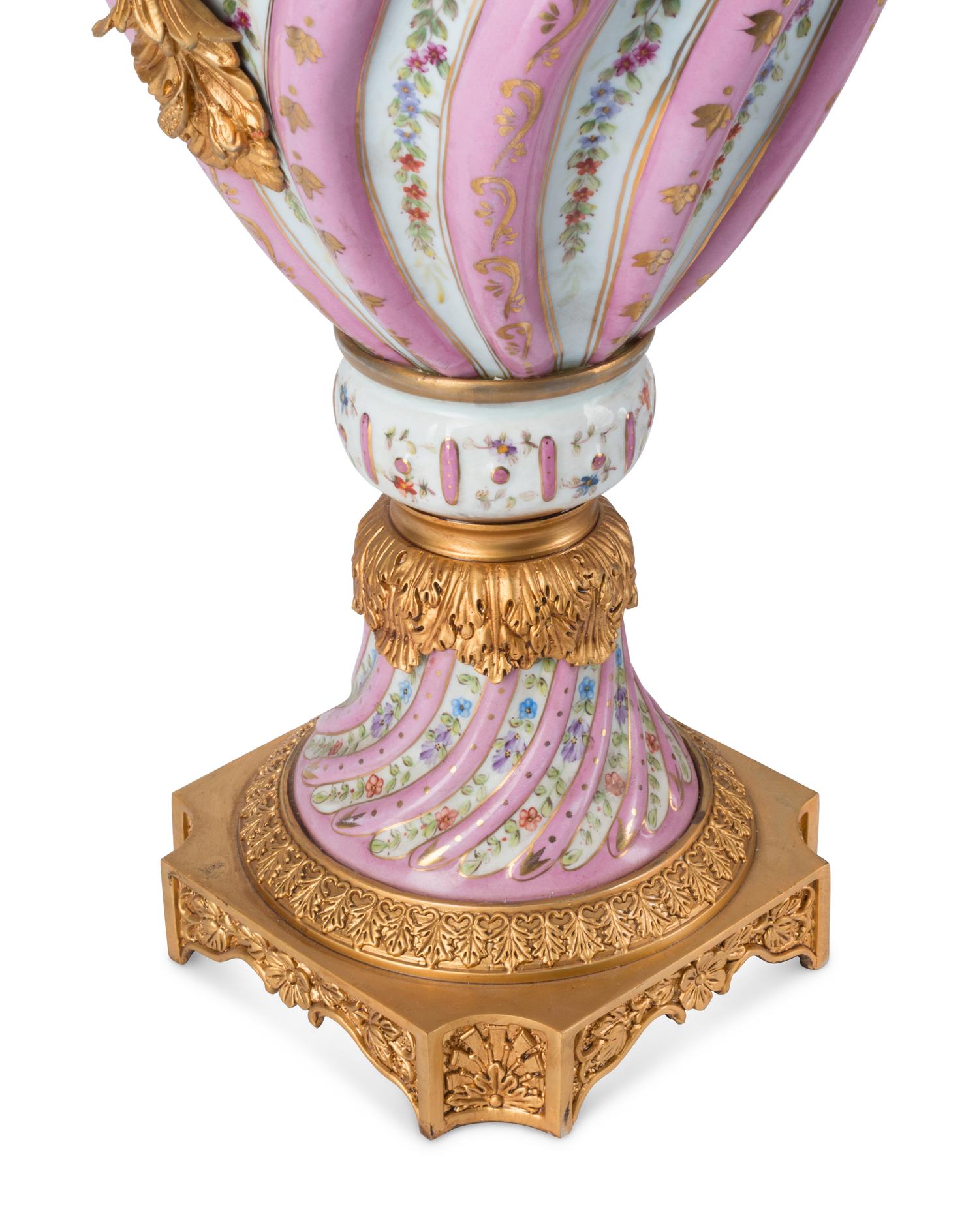 A Pair of Gilt Bronze Mounted Sèvres Style Porcelain Urns