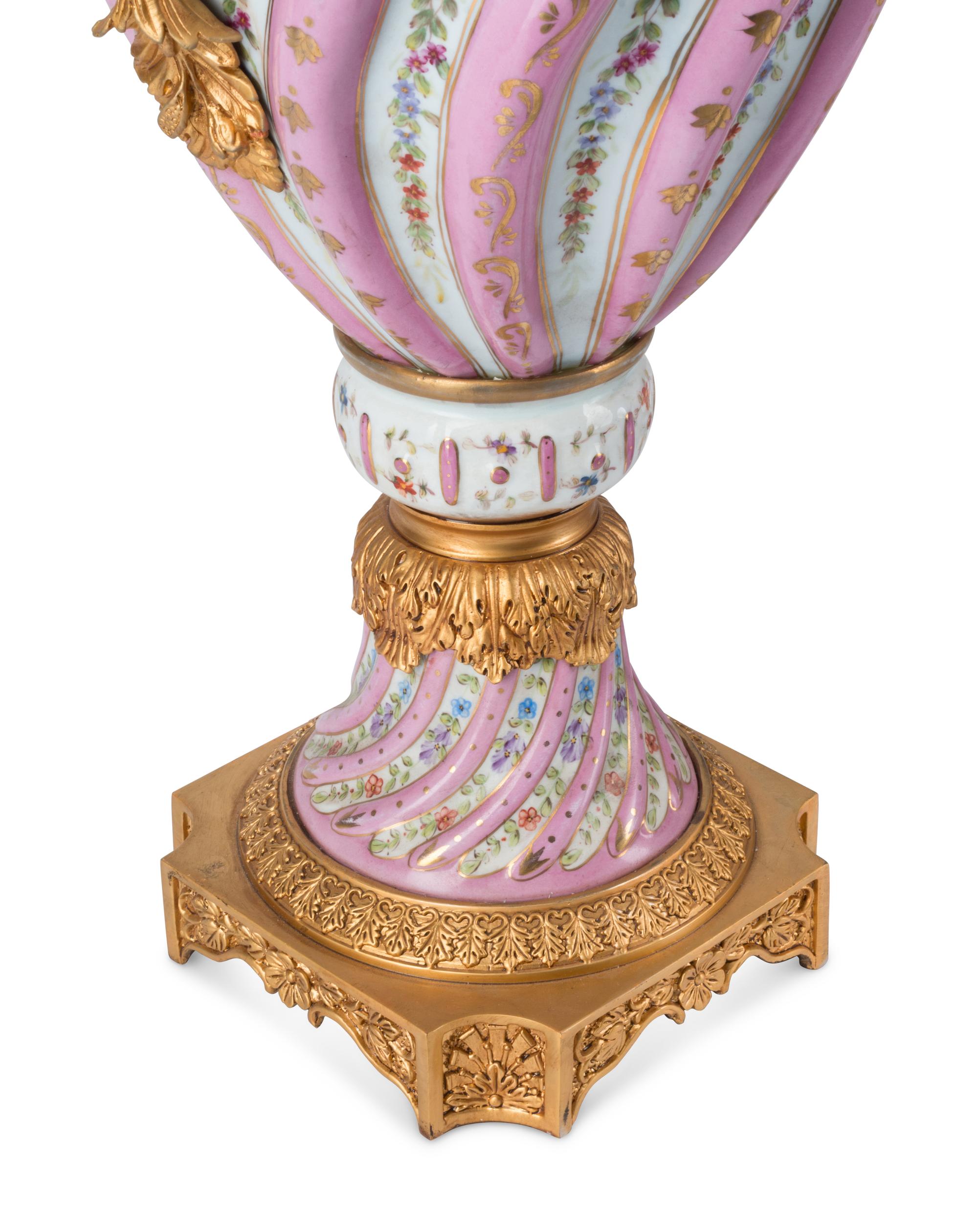 A Pair of Gilt Bronze Mounted Sèvres Style Porcelain Urns