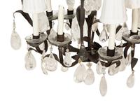 A Wrought Iron and Rock Crystal Eight-Light Chandelier