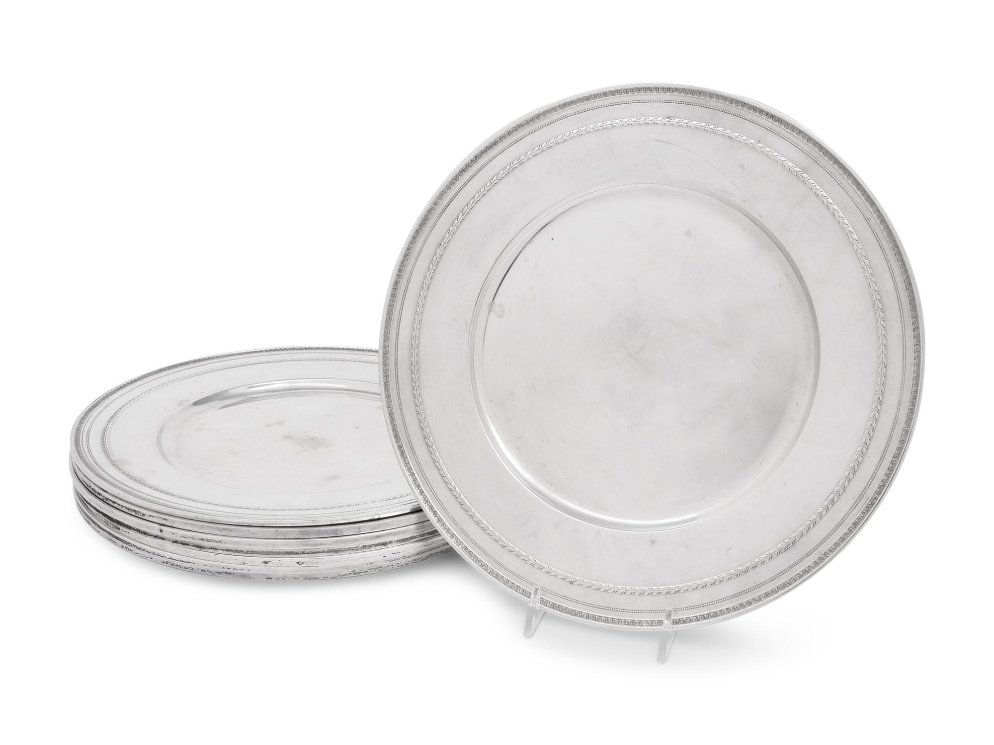 A Set of Eight American Silver Chargers