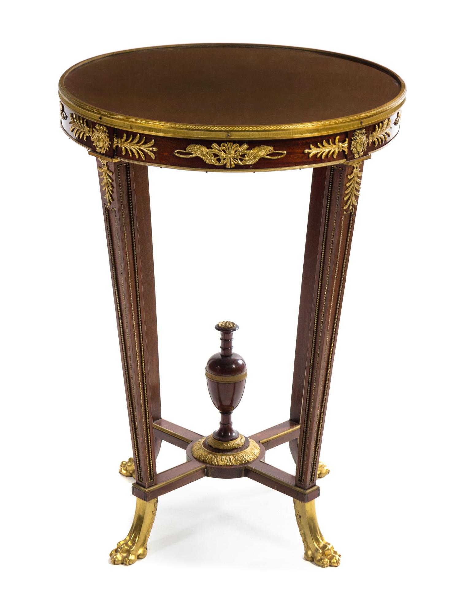 An Empire Style Gilt Bronze Mounted Mahogany Gueridon Height 30 x diameter of top 21 1/2 inches. — LATE 19TH CENTURY