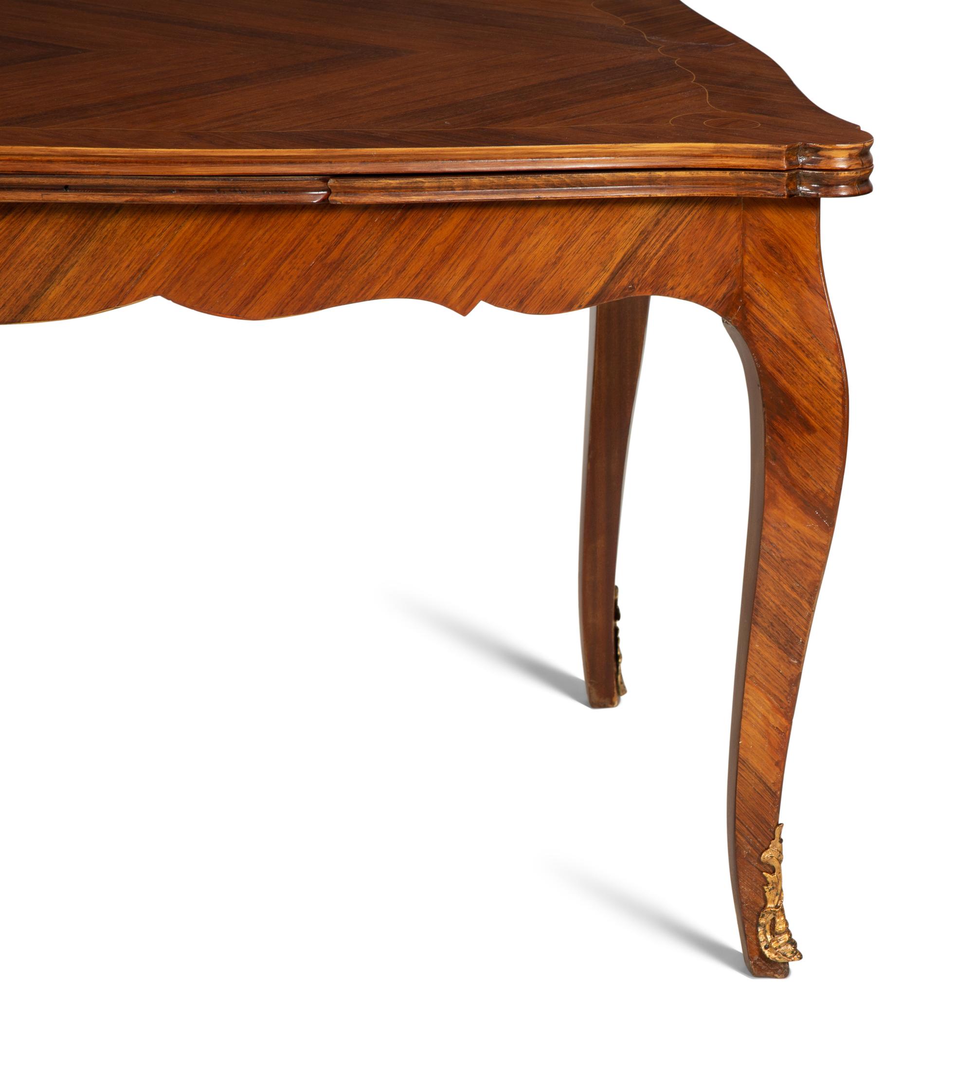 A Louis XV Style Gilt Bronze Mounted Tulipwood and Marquetry Extension Dining Table
