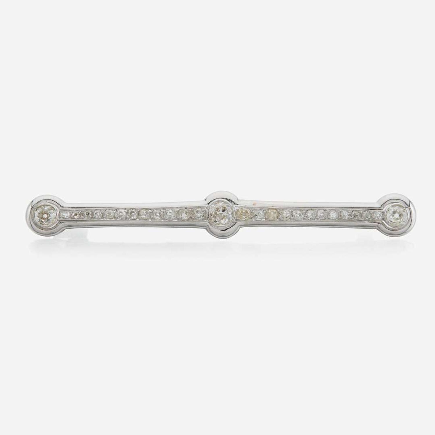 A diamond and white gold brooch