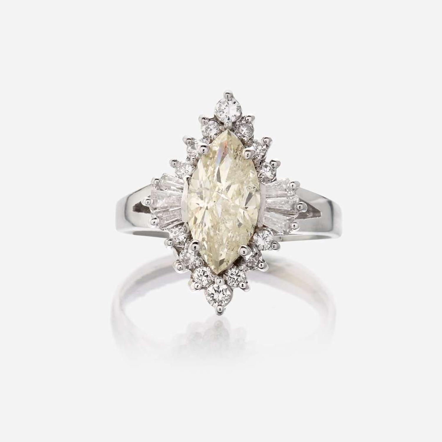 A diamond and eighteen karat white gold ring