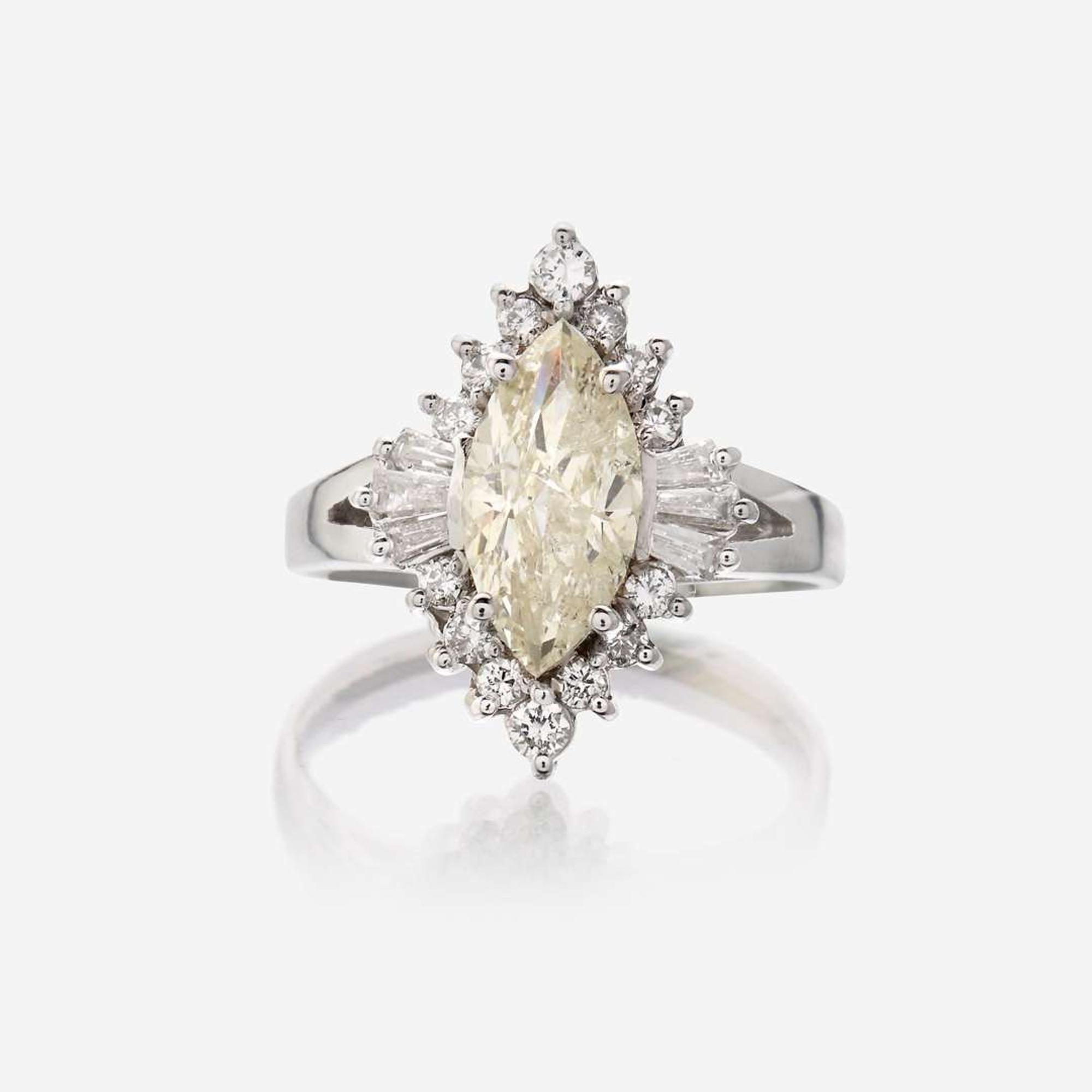 A diamond and eighteen karat white gold ring