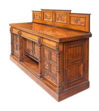 A Continental Carved Walnut and Burlwood Serving Cabinet