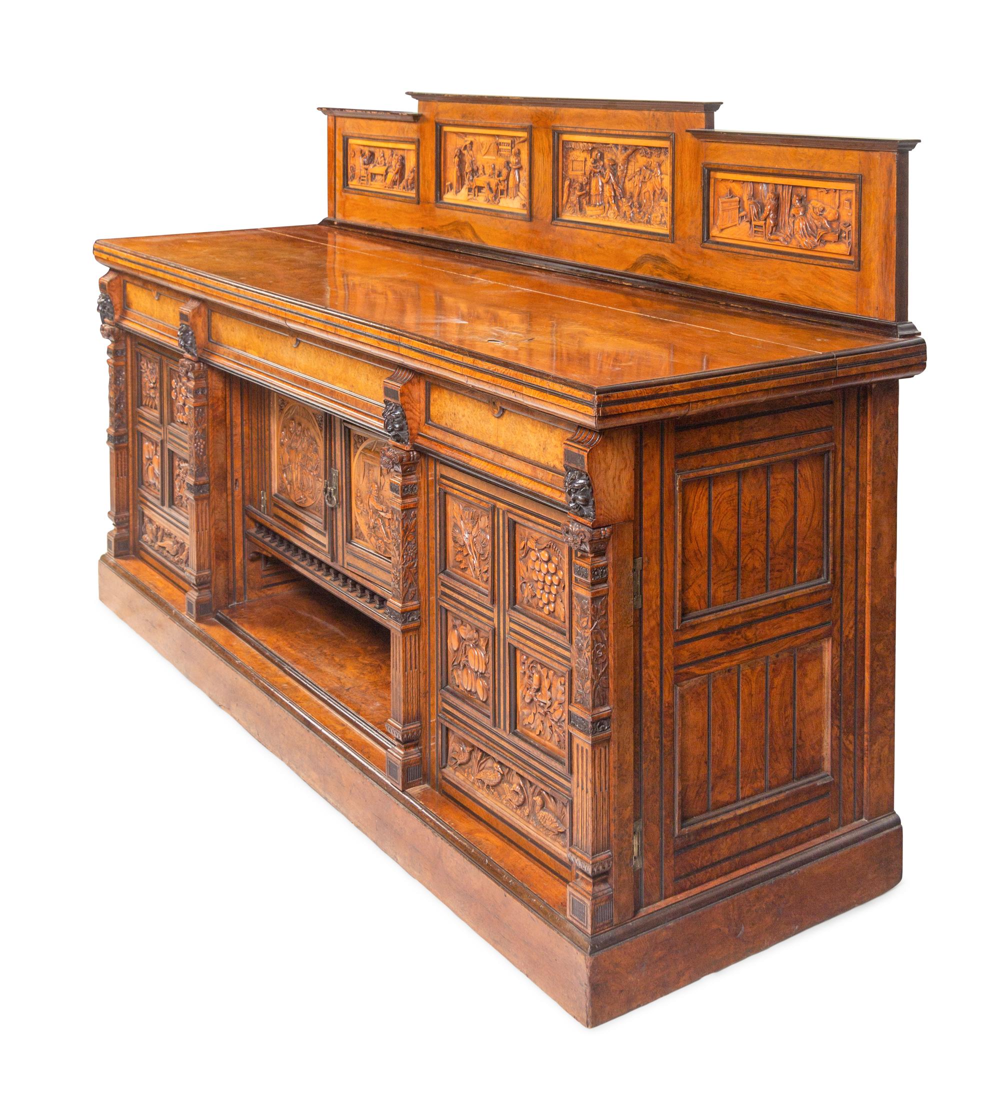 A Continental Carved Walnut and Burlwood Serving Cabinet