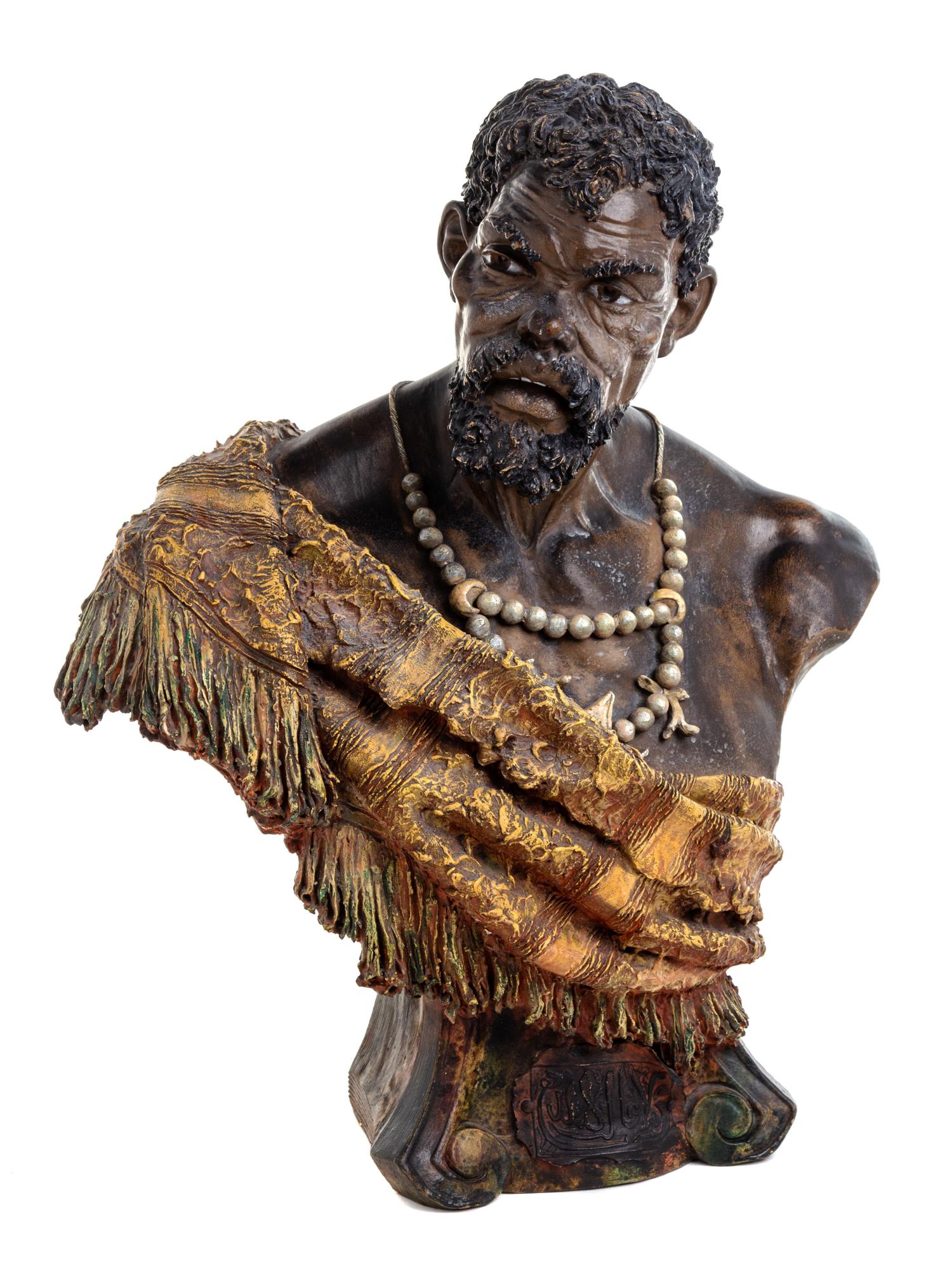 A Painted Terra Cotta Bust of a North African Man Height 18 1/2 inches. — LATE 19TH CENTURY