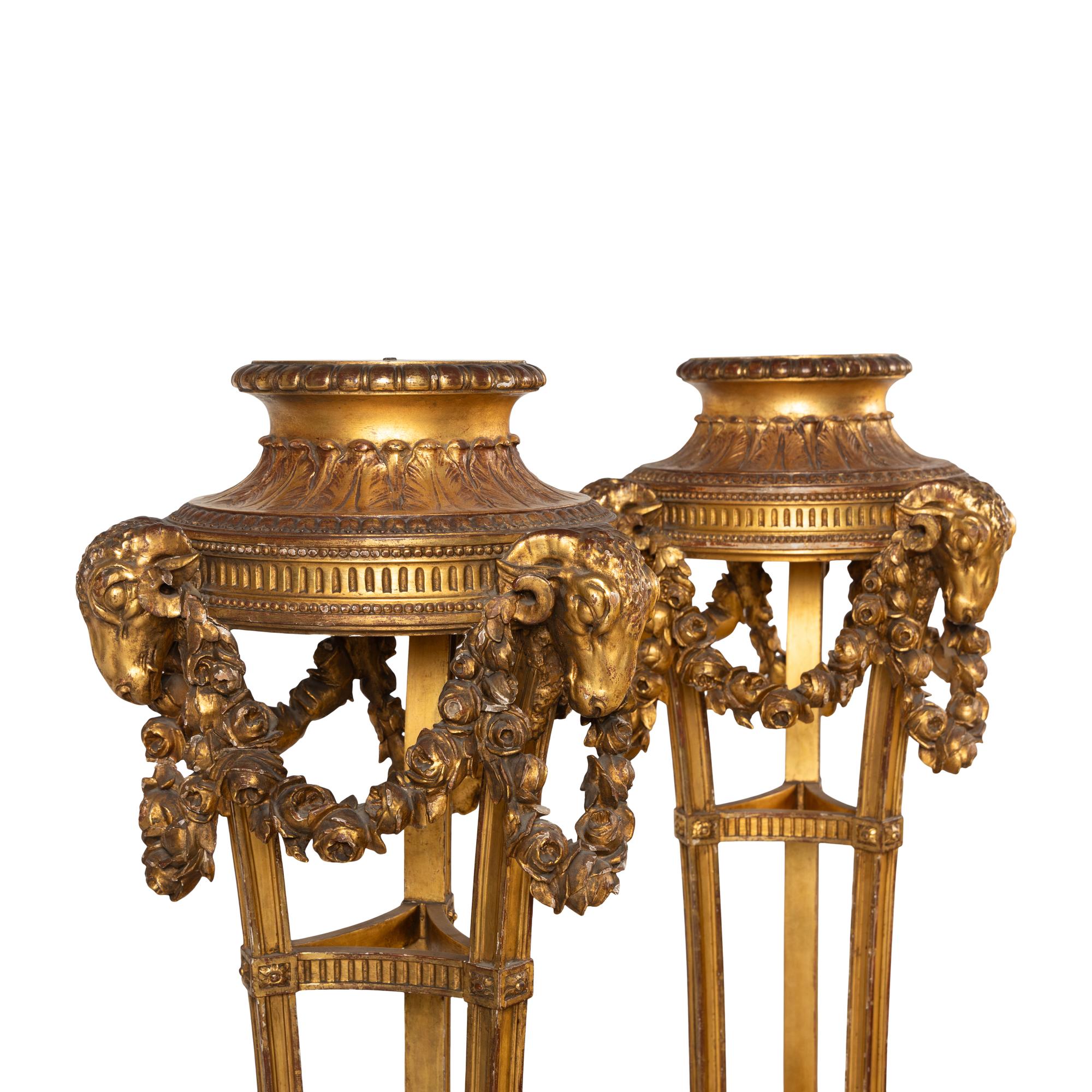 A Pair of George III Style Giltwood Torchères