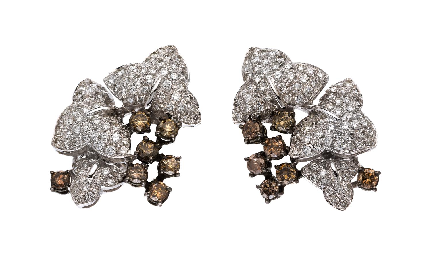 A Pair of 18 Karat White Gold, Colored Diamond and Diamond Earclips, 13.70 dwts.