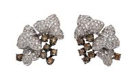 A Pair of 18 Karat White Gold, Colored Diamond and Diamond Earclips, 13.70 dwts.