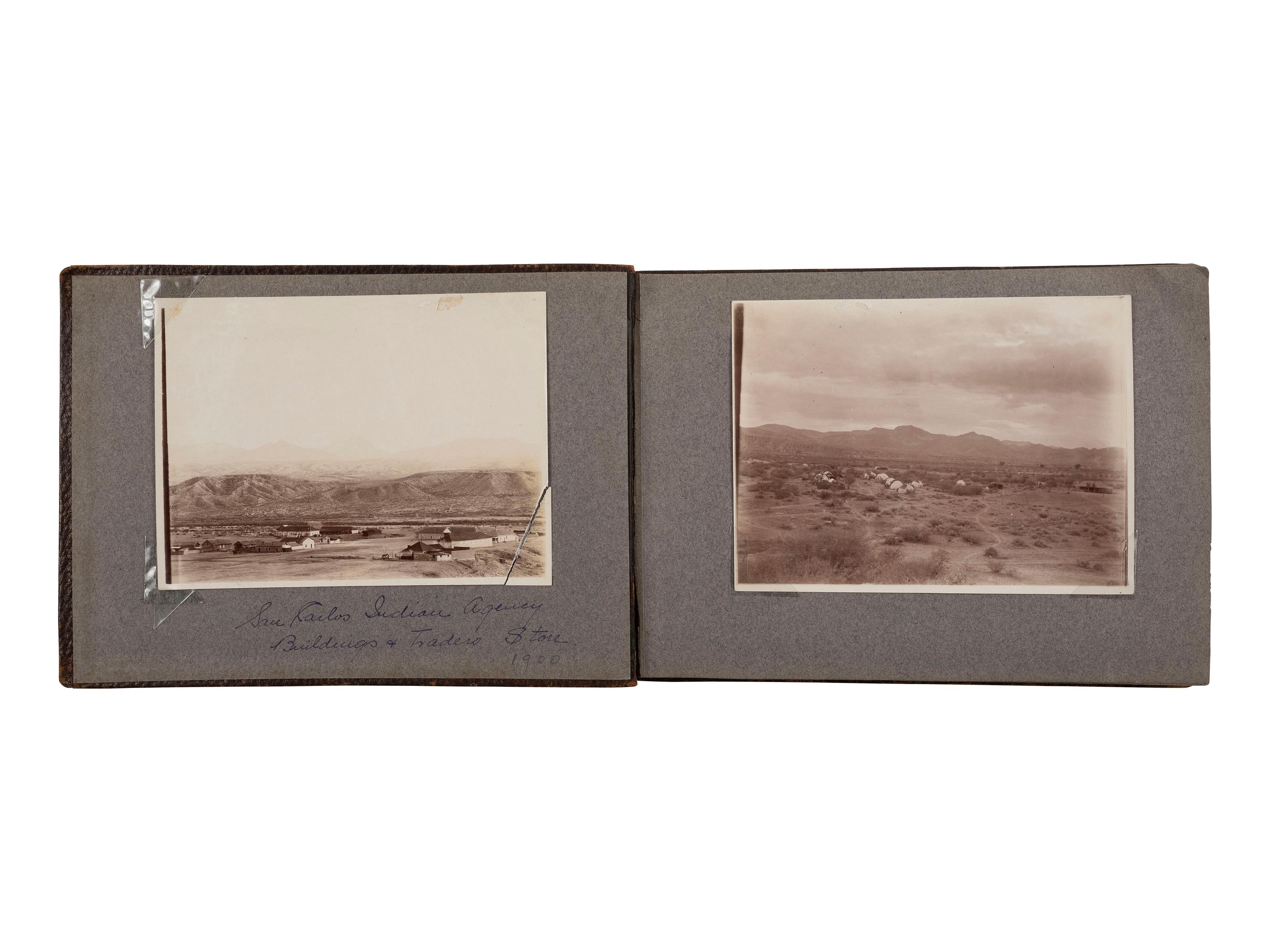 [NATIVE AMERICANS]. JONES, John Edward (1863-1922), photographer. Album containing 50 photographs of the San Carlos Indian Agency, including Apache civilians and police, agency buildings and dwellings, and scenic views. Ca 1904.