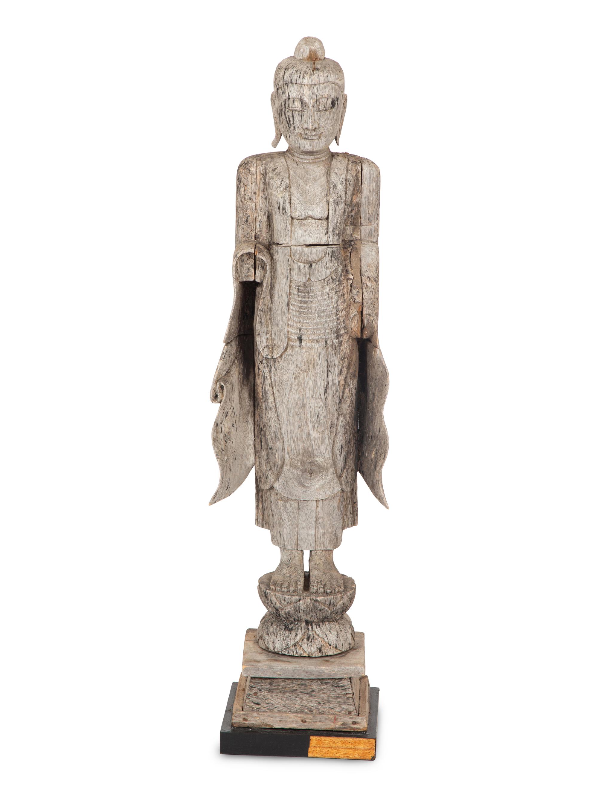 A Southeast Asian Carved Figure of Guan Yin