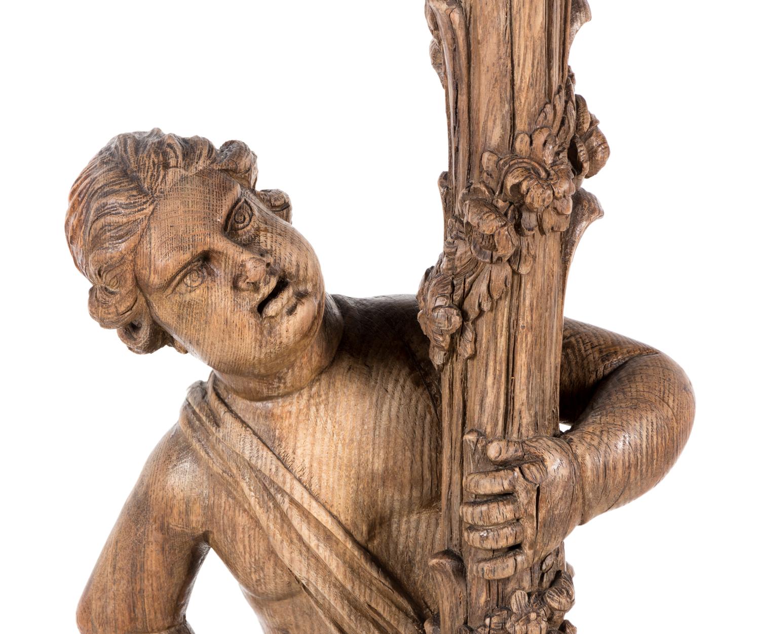 A Continental Carved Oak Figural Pedestal