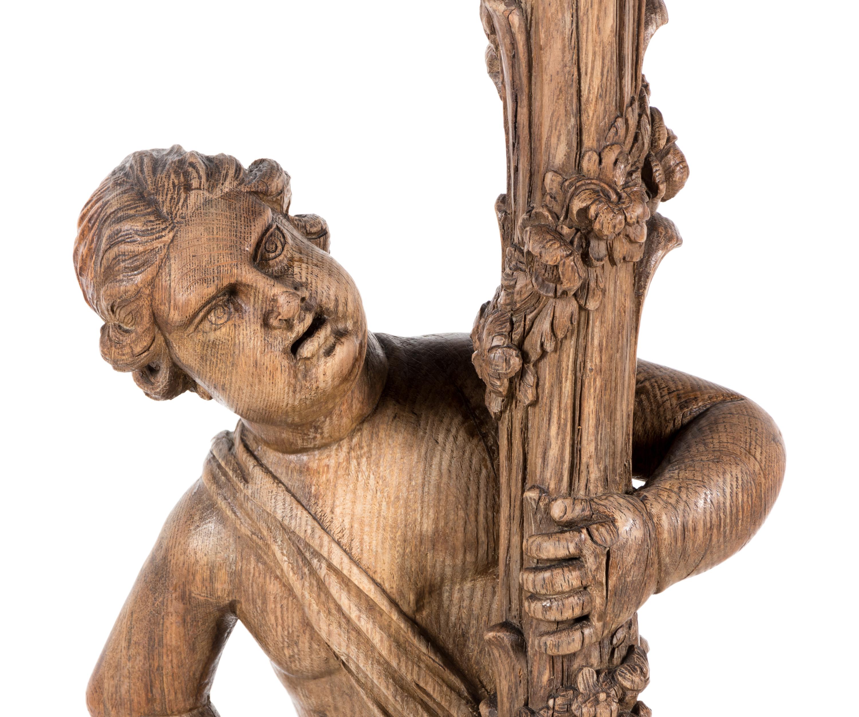 A Continental Carved Oak Figural Pedestal