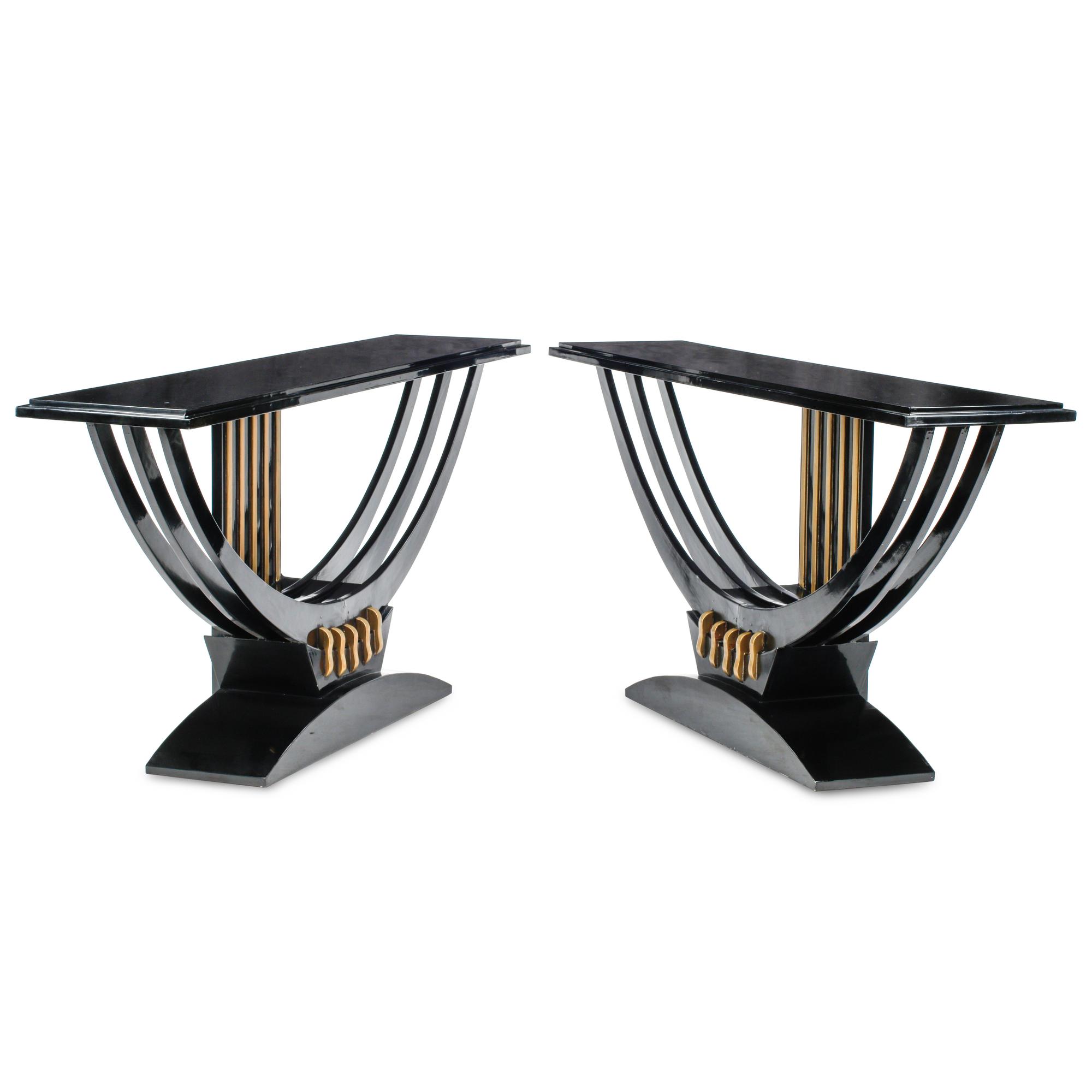 A Pair of Art Deco Style Black Lacquered and Parcel Gilt Console Tables