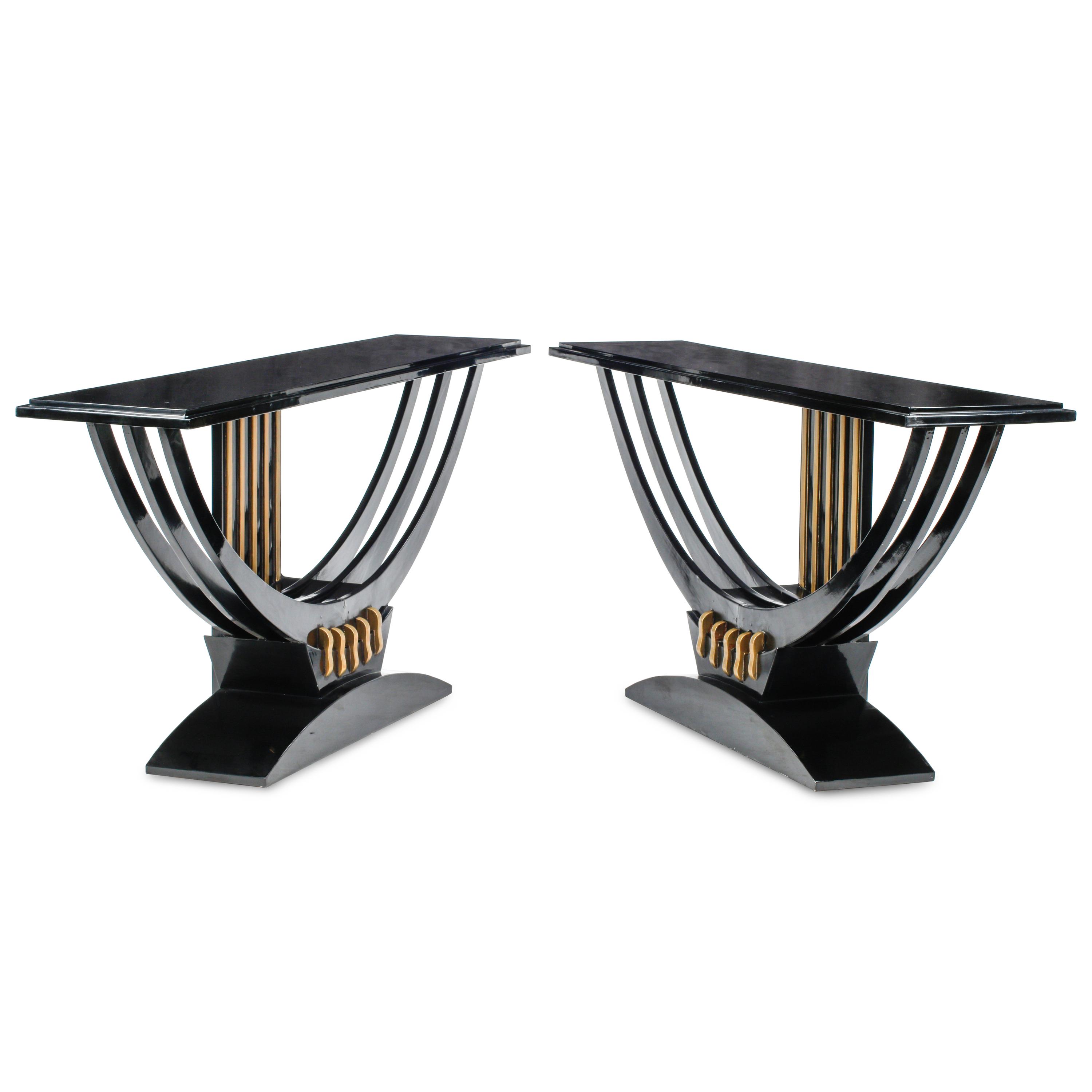 A Pair of Art Deco Style Black Lacquered and Parcel Gilt Console Tables