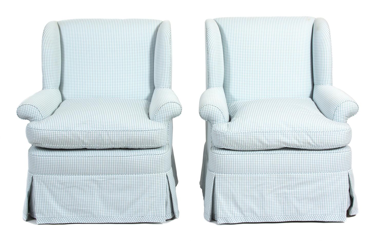 A Pair of Blue and White Checked Upholstered Wing Chairs Height 34 1/2 x width 25 1/2 x depth 21 inches. — 20TH CENTURY