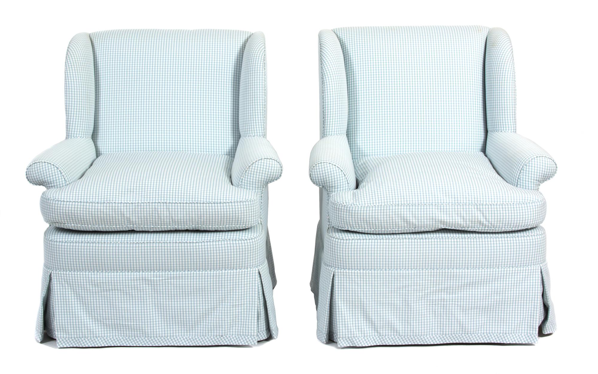 A Pair of Blue and White Checked Upholstered Wing Chairs Height 34 1/2 x width 25 1/2 x depth 21 inches. — 20TH CENTURY