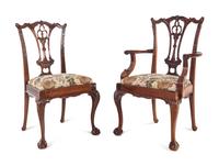 A Set of Twelve George II Style Carved Mahogany Dining Chairs