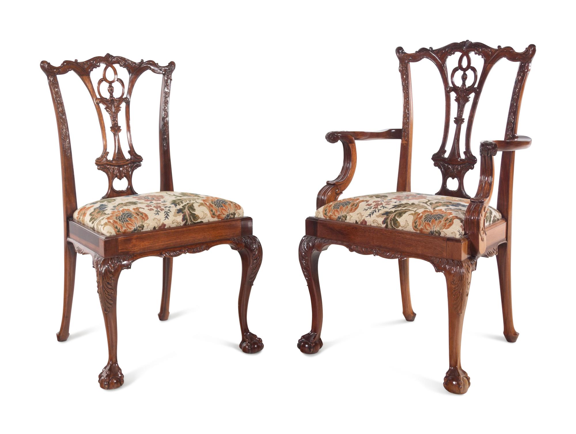 A Set of Twelve George II Style Carved Mahogany Dining Chairs