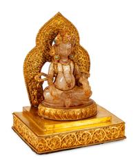 A Chinese Rock Crystal Figure of a Seated Deity