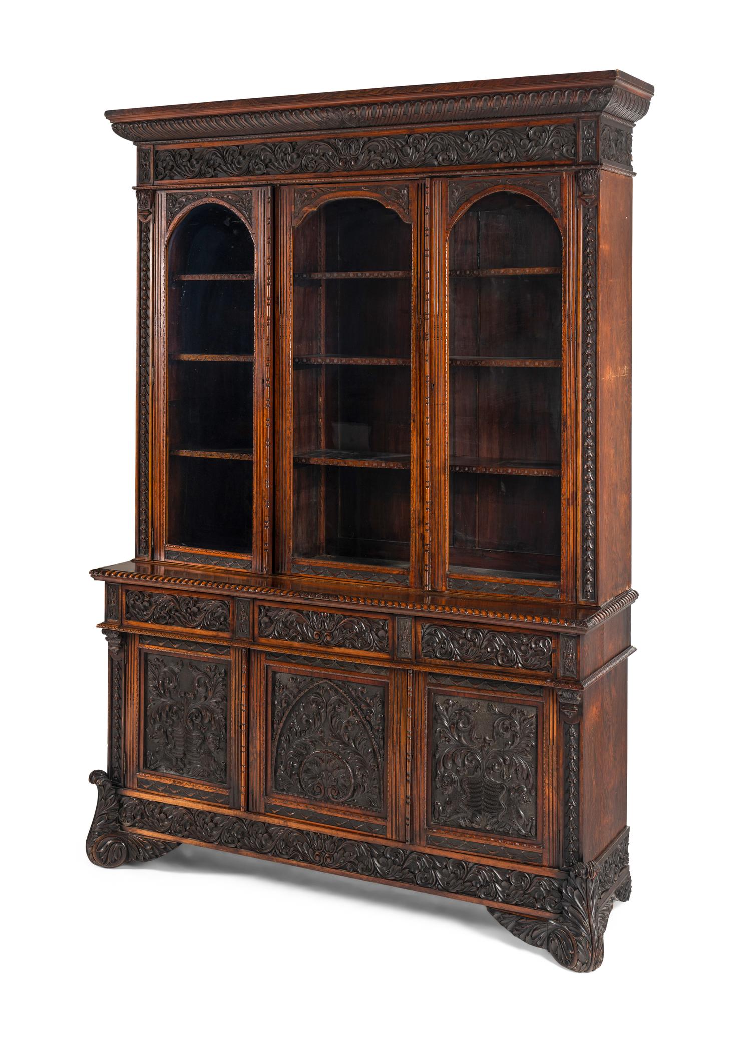 An Italian Rosewood and Carved Walnut Bookcase
