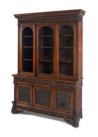 An Italian Rosewood and Carved Walnut Bookcase
