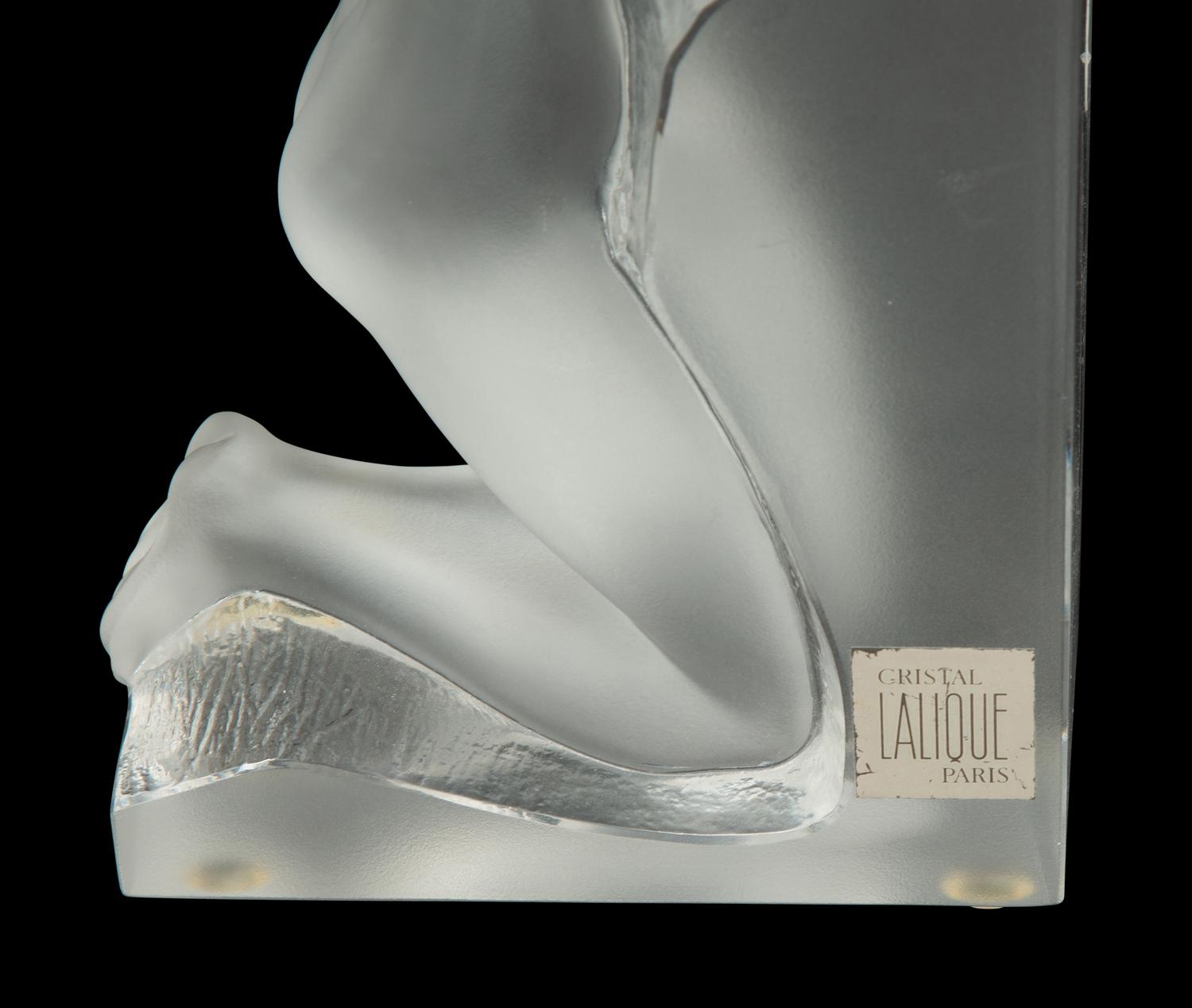 A Pair of Lalique Reverie Bookends and a Bacchantes Figural Group