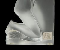 A Pair of Lalique Reverie Bookends and a Bacchantes Figural Group