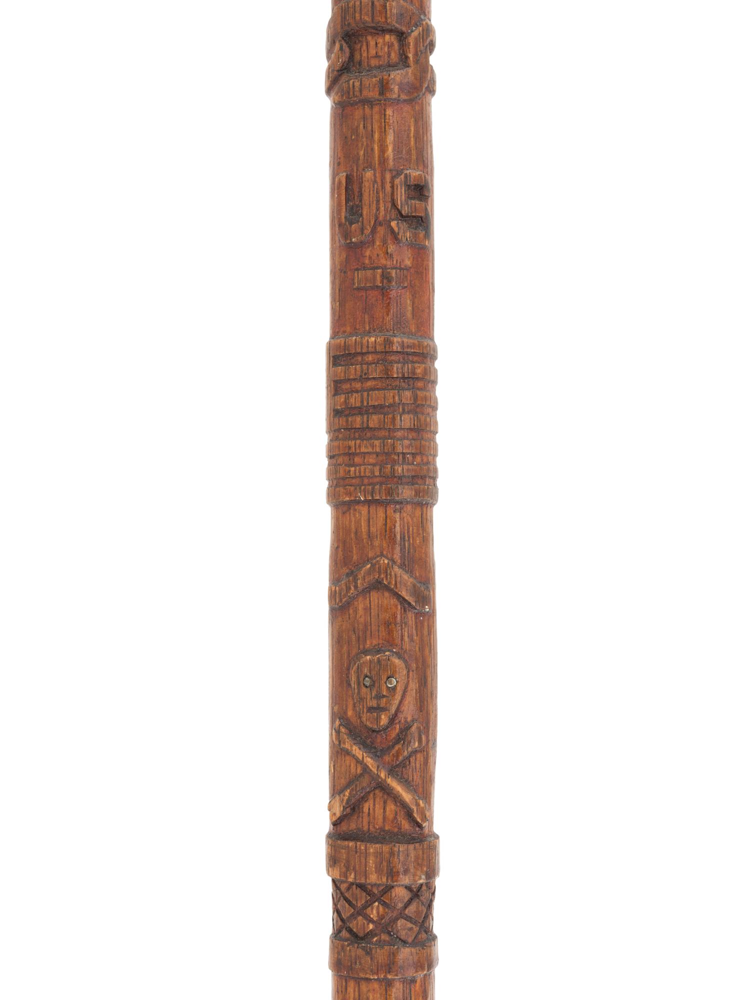 [CIVIL WAR]. GAR folk art carved cane featuring corps badges and patriotic motifs.