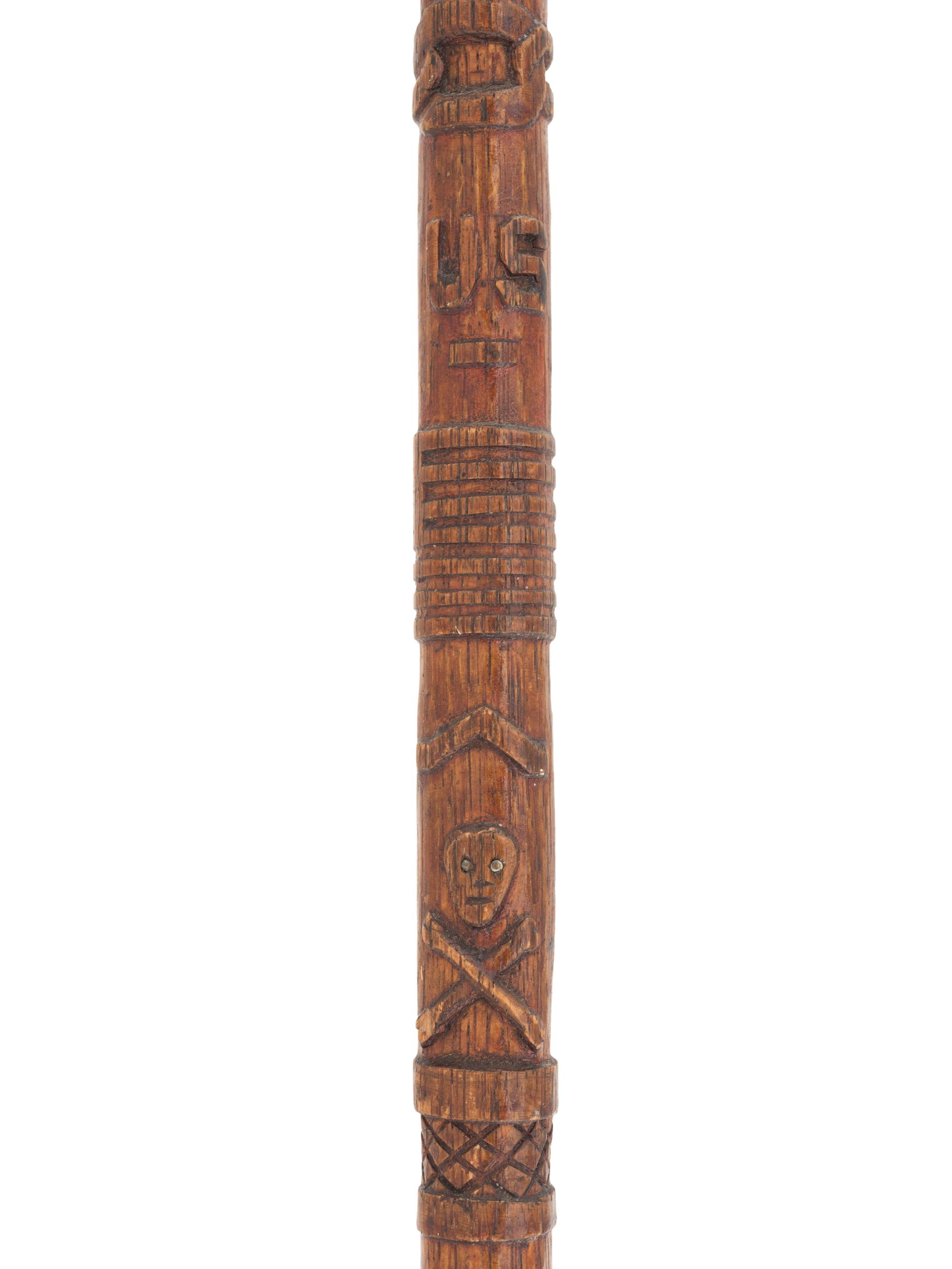 [CIVIL WAR]. GAR folk art carved cane featuring corps badges and patriotic motifs.