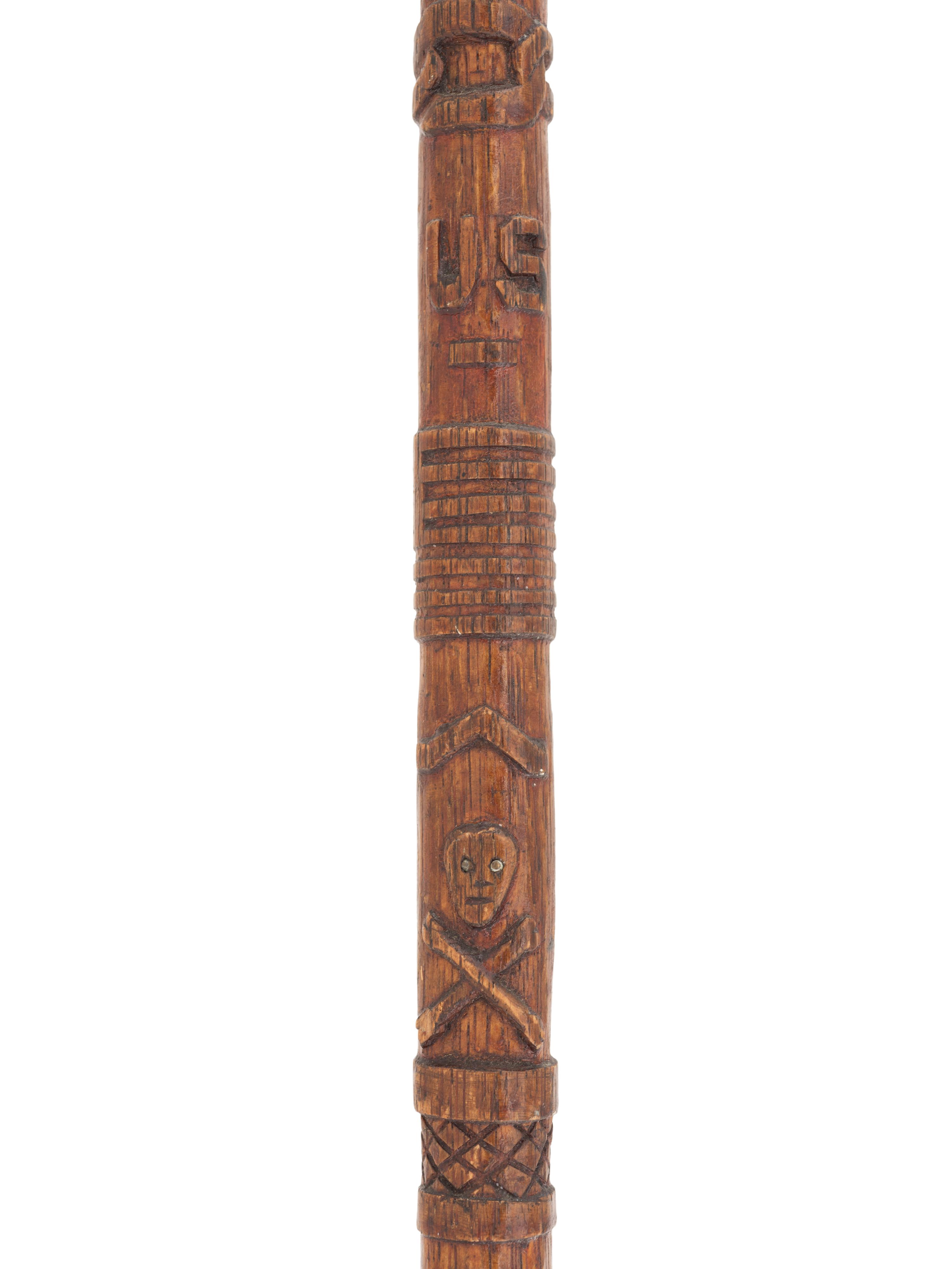 [CIVIL WAR]. GAR folk art carved cane featuring corps badges and patriotic motifs.