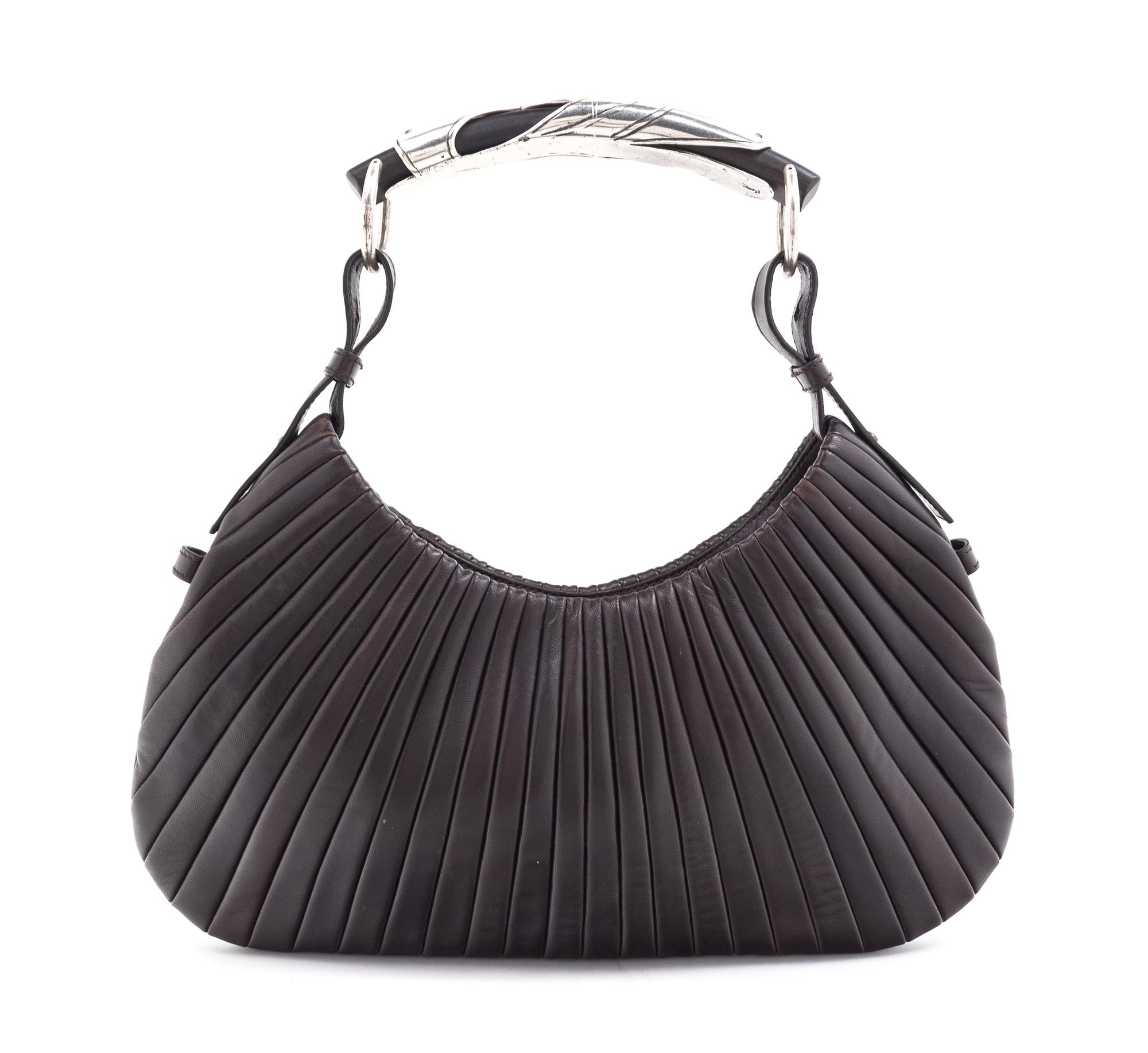 An Yves Saint Laurent Brown Leather Mombasa Handbag, 14" x 6" x .5".