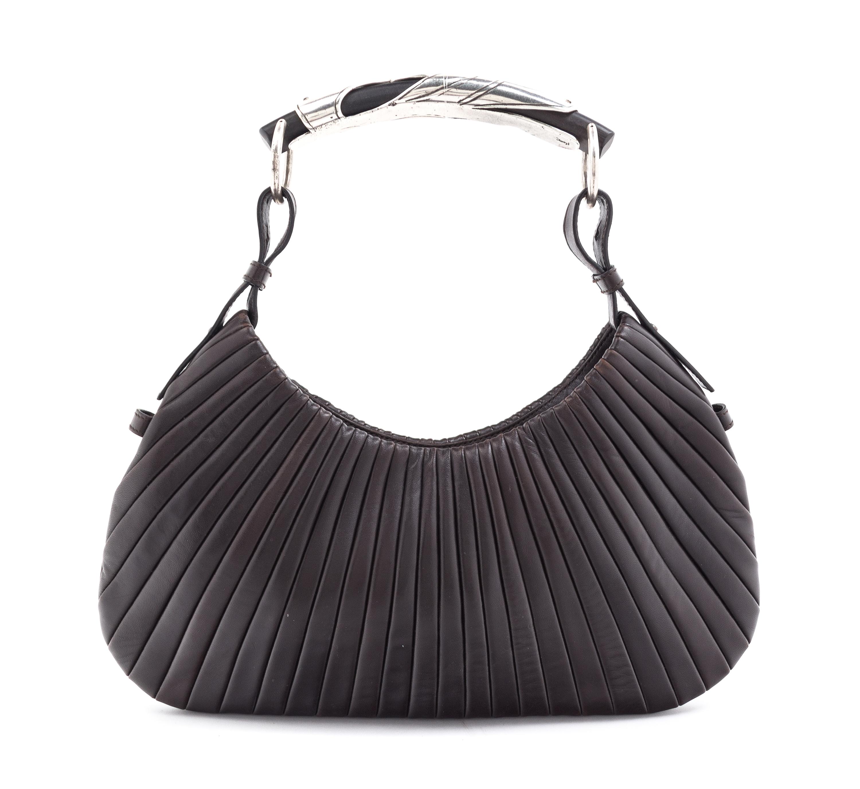 An Yves Saint Laurent Brown Leather Mombasa Handbag, 14" x 6" x .5".