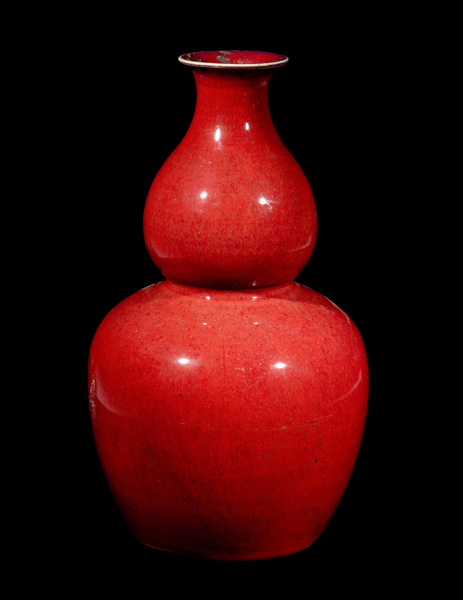 A Chinese Sang-de-Boeuf Glazed Porcelain Gourd-Form Vase