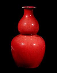 A Chinese Sang-de-Boeuf Glazed Porcelain Gourd-Form Vase