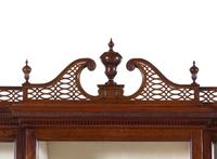 A Late George III Pierce Carved and Figured Mahogany Breakfront Cabinet