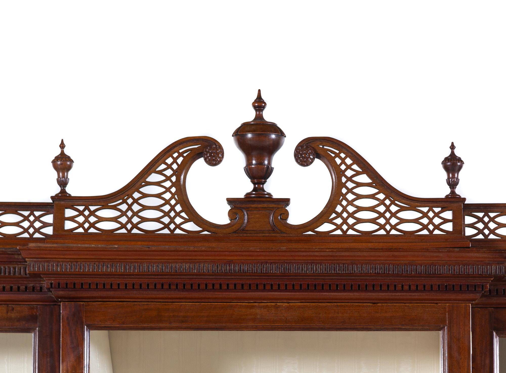 A Late George III Pierce Carved and Figured Mahogany Breakfront Cabinet