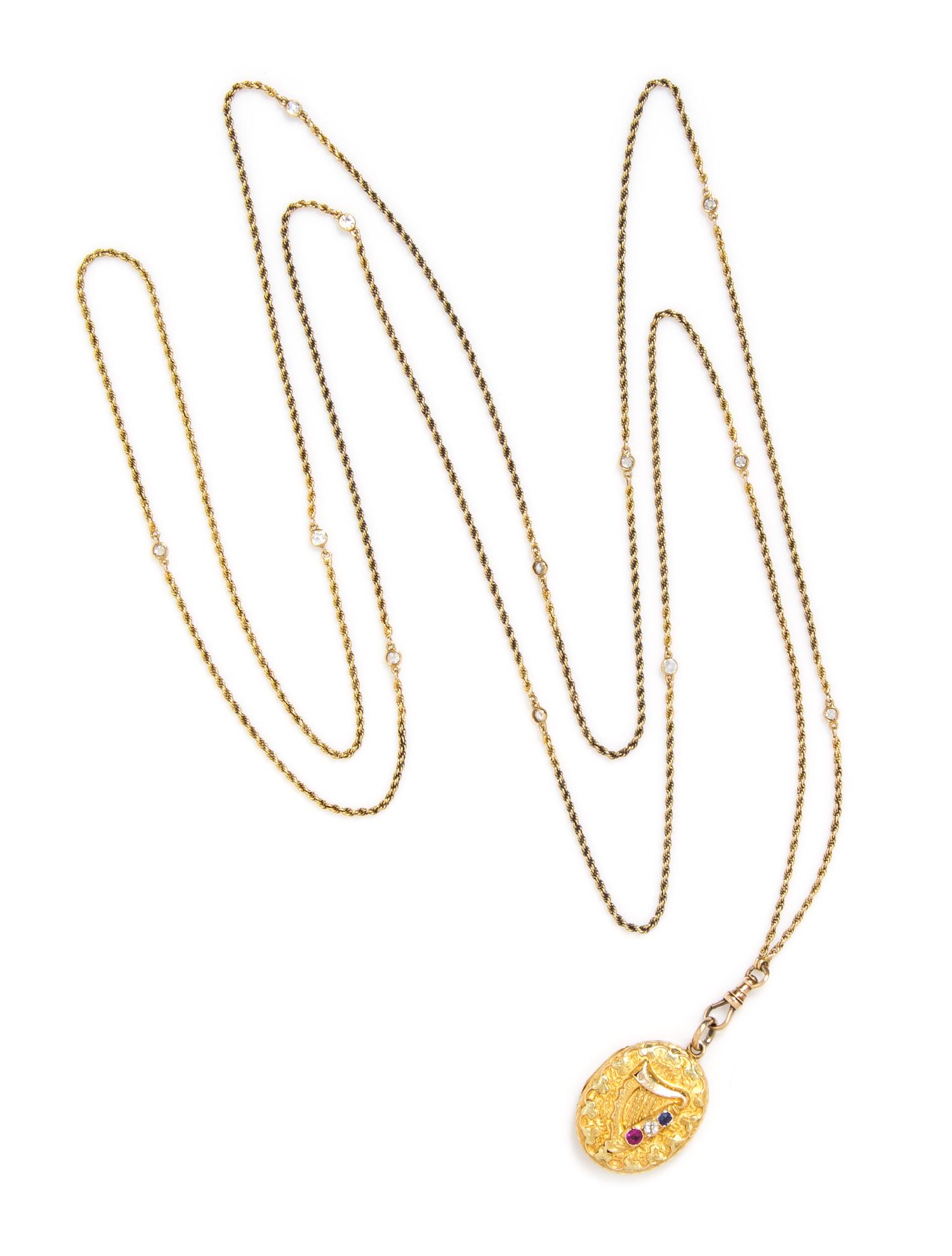 A 14 Karat Yellow Gold, Rolled Gold, Ruby, Diamond and Sapphire Locket Necklace, 15.30 dwts.