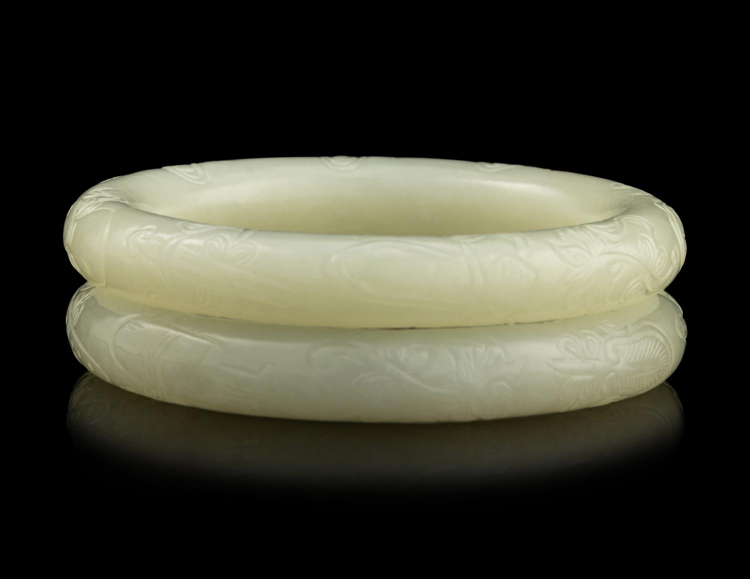 A Pair of Carved White Jade Bangles