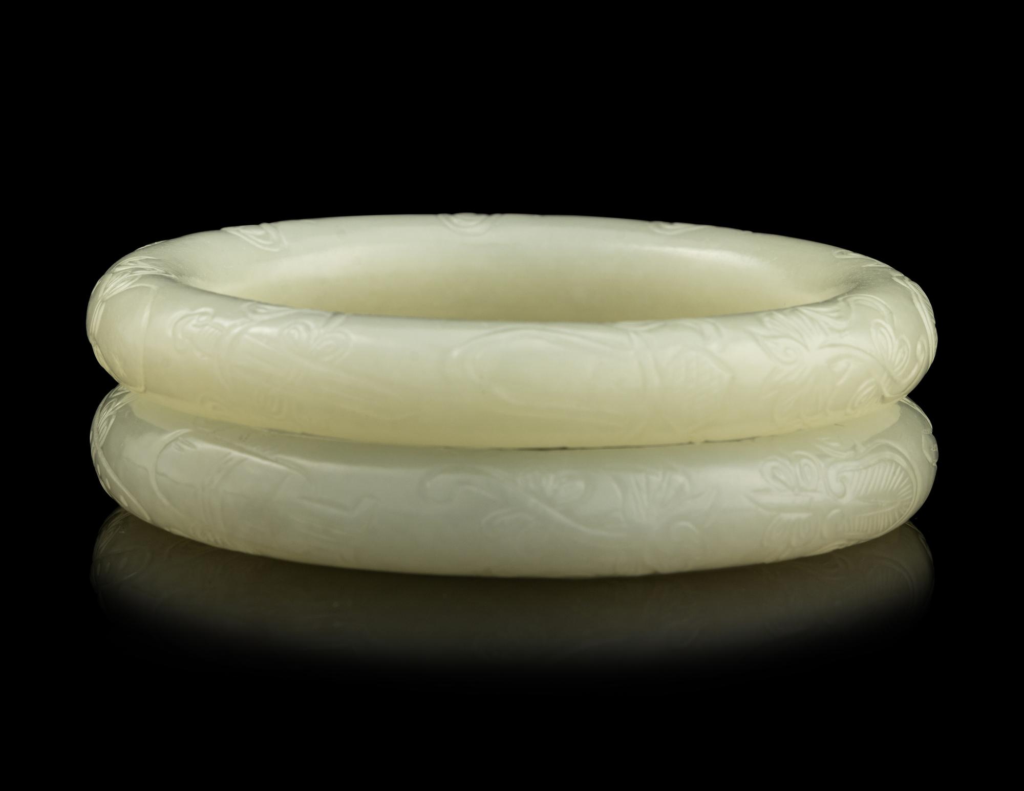 A Pair of Carved White Jade Bangles