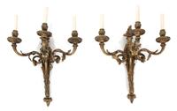 A Pair of Louis XVI Style Gilt Bronze Three-Light Wall Sconces Height 20 x length 19 inches. — 19TH CENTURY